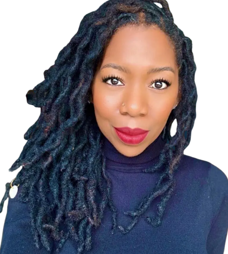 Portrait of Noelle Ranzy smiling in a close-up headshot