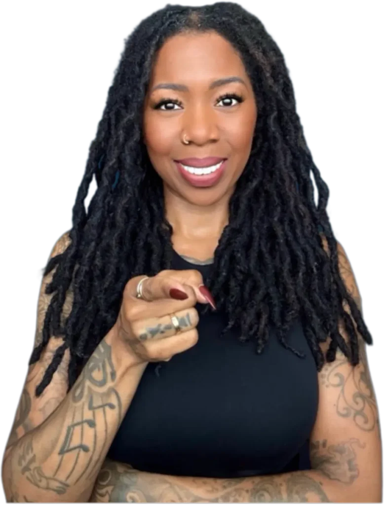 Noelle Ranzy smiling and pointing toward the camera