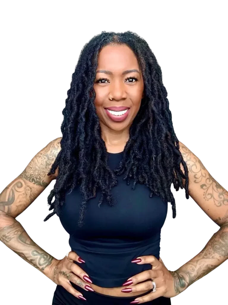 Noelle Ranzy smiling with hands on hips, career coach and leadership strategist.