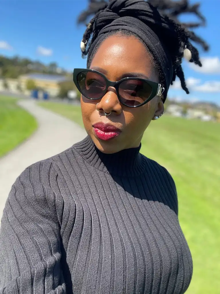 Noelle Ranzy wearing sunglasses outdoors on a sunny day